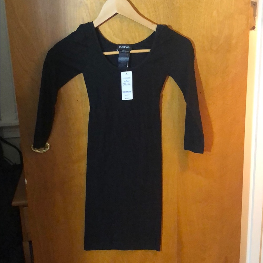 Bebe dress NWT black with a triangle open back